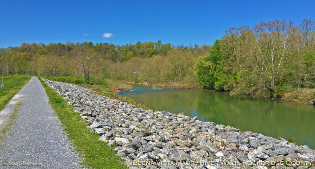 gravel trail running along side a river
